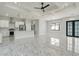 Modern kitchen with white cabinets and stainless steel appliances at 10489 St Paul Dr, Port Charlotte, FL 33981