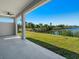 Covered patio overlooking a canal with a dock and lush greenery at 10489 St Paul Dr, Port Charlotte, FL 33981