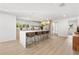 Modern kitchen with light wood cabinets, white countertops, and a large island at 1108 Spencer Ave, Clearwater, FL 33756