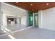 Balcony with tile flooring and sliding glass doors that lead into a living area at 111 Golden Gate Pt # 403, Sarasota, FL 34236