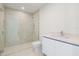 Modern bathroom featuring a glass-enclosed shower and sleek vanity at 111 Golden Gate Pt # 403, Sarasota, FL 34236