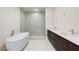 Modern bathroom with a soaking tub, walk-in shower, and dual vanity at 111 Golden Gate Pt # 403, Sarasota, FL 34236