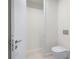 Clean and simple bathroom with toilet and a small storage closet at 111 Golden Gate Pt # 403, Sarasota, FL 34236