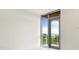 Bedroom featuring a glass patio door with views of the marina at 111 Golden Gate Pt # 403, Sarasota, FL 34236
