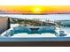 Rooftop hot tub overlooking the bay and bridge, offering a luxurious relaxation experience at 111 Golden Gate Pt # 403, Sarasota, FL 34236