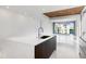 Modern kitchen with quartz island, sleek cabinets, and stunning water view at 111 Golden Gate Pt # 403, Sarasota, FL 34236