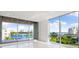 Living room with panoramic water views at 111 Golden Gate Pt # 403, Sarasota, FL 34236