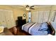 Bedroom with double bed, built in shelving and lots of closet space at 11485 Oakhurst Rd # 200-220, Largo, FL 33774