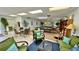 Community room features seating, ping pong, and a library at 11485 Oakhurst Rd # 200-220, Largo, FL 33774