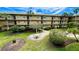 Courtyard with tables, chairs, and lush landscaping at 11485 Oakhurst Rd # 200-220, Largo, FL 33774