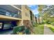 Building exterior showcasing entrance and landscaping at 11485 Oakhurst Rd # 200-220, Largo, FL 33774