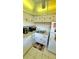 White kitchen with ample cabinetry and countertop space at 11485 Oakhurst Rd # 200-220, Largo, FL 33774