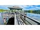 Relaxing gazebo on a pier overlooking a lake at 11485 Oakhurst Rd # 200-220, Largo, FL 33774