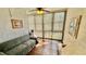 Relaxing sunroom, featuring a comfy couch and plenty of natural light at 11485 Oakhurst Rd # 200-220, Largo, FL 33774
