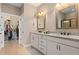 Double vanity bathroom with granite countertop and walk-in shower at 12253 Marsh Pointe Rd, Sarasota, FL 34238