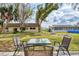 Backyard view with patio furniture and a view of a pool at 13479 Newport Ave, Port Charlotte, FL 33981
