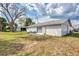 Backyard with patio furniture and a large tree at 13479 Newport Ave, Port Charlotte, FL 33981