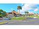 Inviting community center with a stone facade and covered entrance at 13479 Newport Ave, Port Charlotte, FL 33981