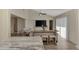 Kitchen island with seating overlooking living area at 13479 Newport Ave, Port Charlotte, FL 33981
