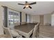 Dining room with a large table and chairs, and views to the front yard at 13479 Newport Ave, Port Charlotte, FL 33981