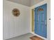 Blue front door with sidelights and a decorative metal accent at 13479 Newport Ave, Port Charlotte, FL 33981