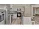 Bright kitchen with stainless steel appliances and an island at 13479 Newport Ave, Port Charlotte, FL 33981