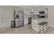 Modern kitchen with stainless steel appliances and granite island at 13479 Newport Ave, Port Charlotte, FL 33981