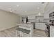 Updated kitchen featuring granite island and white shaker cabinets at 13479 Newport Ave, Port Charlotte, FL 33981