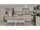 Modern kitchen with stainless steel appliances and granite countertops at 13479 Newport Ave, Port Charlotte, FL 33981