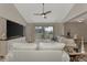 Spacious living room with sectional sofa, large TV and sliding door to backyard at 13479 Newport Ave, Port Charlotte, FL 33981