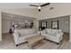 Living room with sectional sofa, coffee table and view to kitchen at 13479 Newport Ave, Port Charlotte, FL 33981