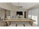 Living room with sectional sofa, large TV and access to patio at 13479 Newport Ave, Port Charlotte, FL 33981