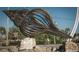 Large metal seashell sculpture near a paved path and beach access at 13479 Newport Ave, Port Charlotte, FL 33981
