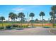Well-maintained tennis courts surrounded by lush tropical landscaping at 13479 Newport Ave, Port Charlotte, FL 33981