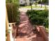 Brick walkway to the front door with lush landscaping at 1667 Laurel St, Sarasota, FL 34236