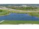 Aerial view of a lake with golf course and conservation area at 17665 Boracay Ct # 202, Venice, FL 34293