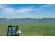 Golf course driving range with lake in background at 17665 Boracay Ct # 202, Venice, FL 34293