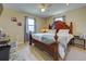 Main bedroom with king-size bed, dresser and ceiling fan at 2443 Aquilos Ct, Port Charlotte, FL 33952