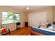 Bedroom with daybed, wood flooring, and a window at 2623 Riverbluff Pkwy # 144, Sarasota, FL 34231