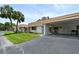 View of multiple homes with carports and lush landscaping at 2623 Riverbluff Pkwy # 144, Sarasota, FL 34231