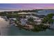 Aerial view of waterfront property with marina, restaurant, and parking at 312 Yacht Harbor Dr, Osprey, FL 34229