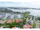 Breathtaking aerial view of waterfront property with private marina access and lush tropical landscaping at 312 Yacht Harbor Dr, Osprey, FL 34229