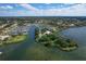 Aerial view of waterfront homes and a marina at 312 Yacht Harbor Dr, Osprey, FL 34229