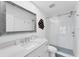 Modern bathroom features a glass shower, a large mirror, and contemporary fixtures at 312 Yacht Harbor Dr, Osprey, FL 34229