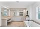 Large Primary bathroom with double vanity and soaking tub at 312 Yacht Harbor Dr, Osprey, FL 34229