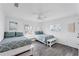 Bright bedroom with two twin beds features a window with blinds and hardwood floors throughout at 312 Yacht Harbor Dr, Osprey, FL 34229