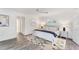 Bright bedroom features an area rug on hard wood floors, natural light and crisp white trim at 312 Yacht Harbor Dr, Osprey, FL 34229