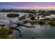 Aerial view of a drawbridge over a waterway at sunset at 312 Yacht Harbor Dr, Osprey, FL 34229