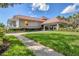 Inviting community clubhouse with ample parking and landscaping at 312 Yacht Harbor Dr, Osprey, FL 34229