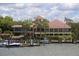 Waterfront clubhouse with boat docks and beautiful landscaping at 312 Yacht Harbor Dr, Osprey, FL 34229